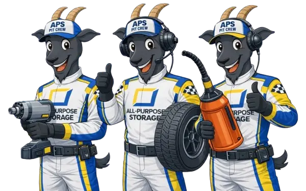 The All-Purpose Storage goat mascot team in racing pit crew uniforms at the racetrack
